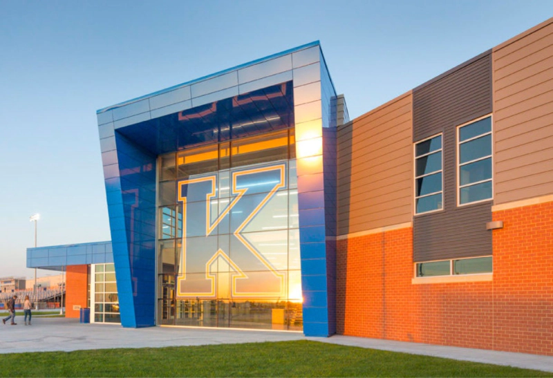 school building entrance with large k on windows
